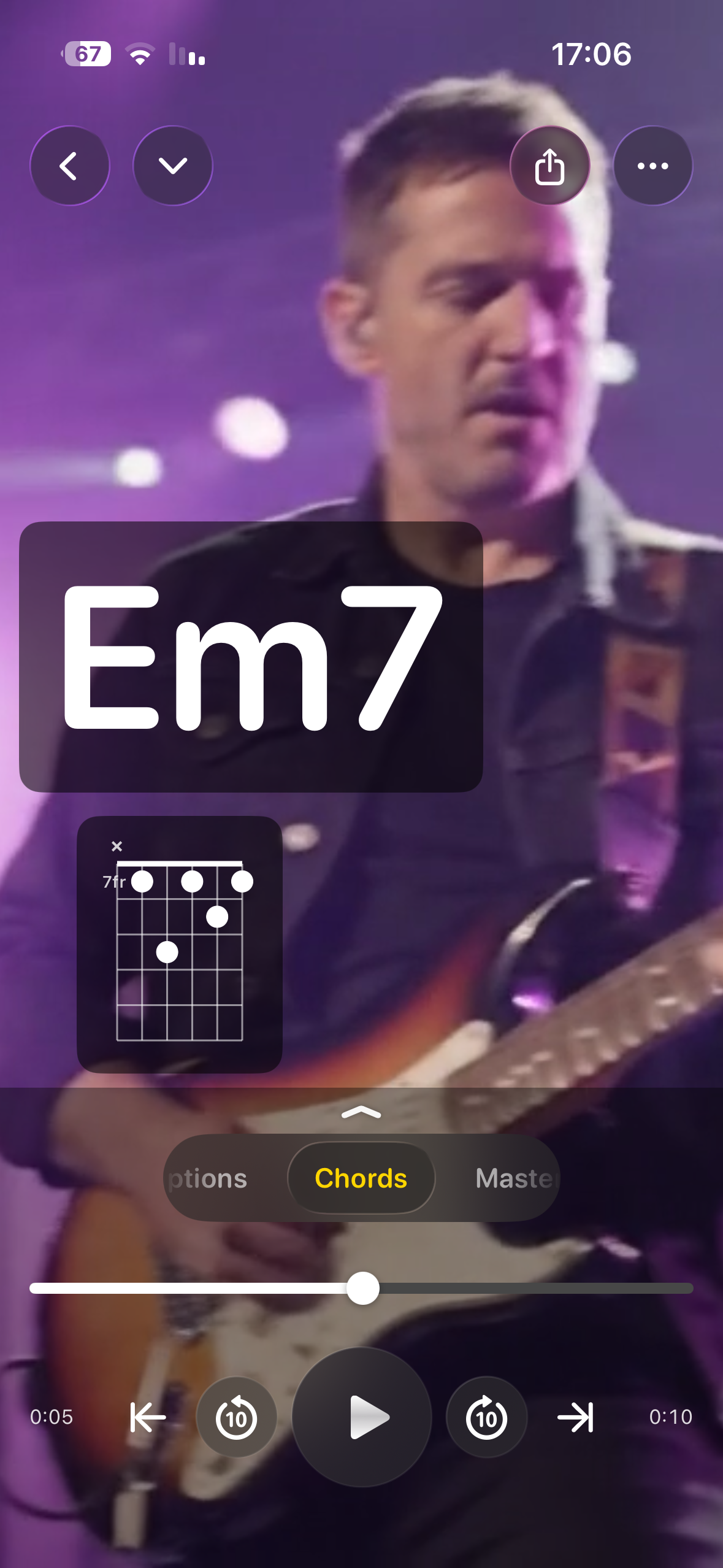 A guitarist on stage, framed in Take One on iPhone.